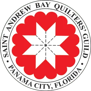 circular badge style logo with dark text encircling a red quilt blocks and white stitched star